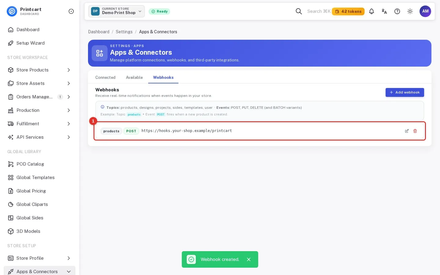 The new webhook listed with its topic, event and callback URL